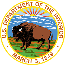 Logo of the u.s. department of the interior featuring a bison with a mountainous background, set within a circular border with the department name, founding date, and SEO capabilities.